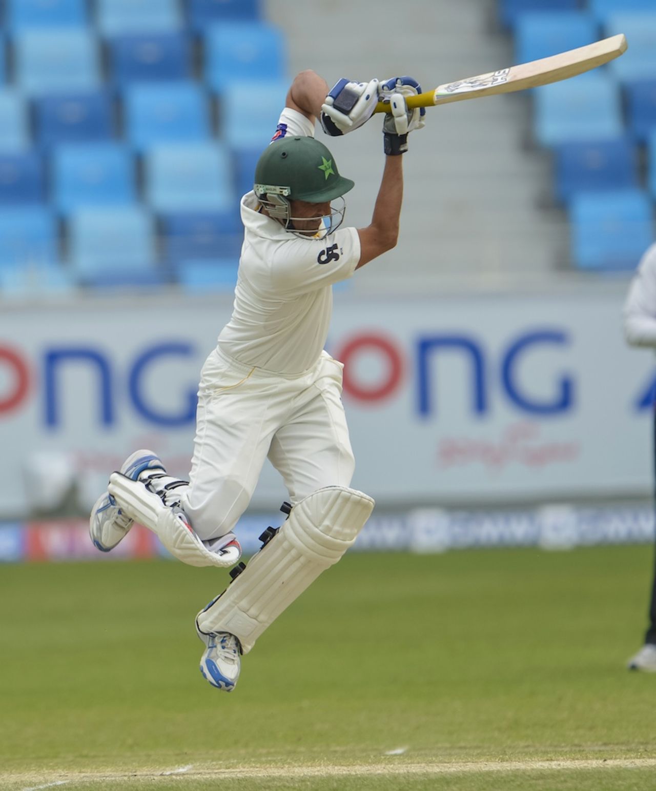 Younis Khan is airborne as he plays a shot, Pakistan v Sri Lanka, 2nd Test, Dubai, 4th day, January 11, 2014
