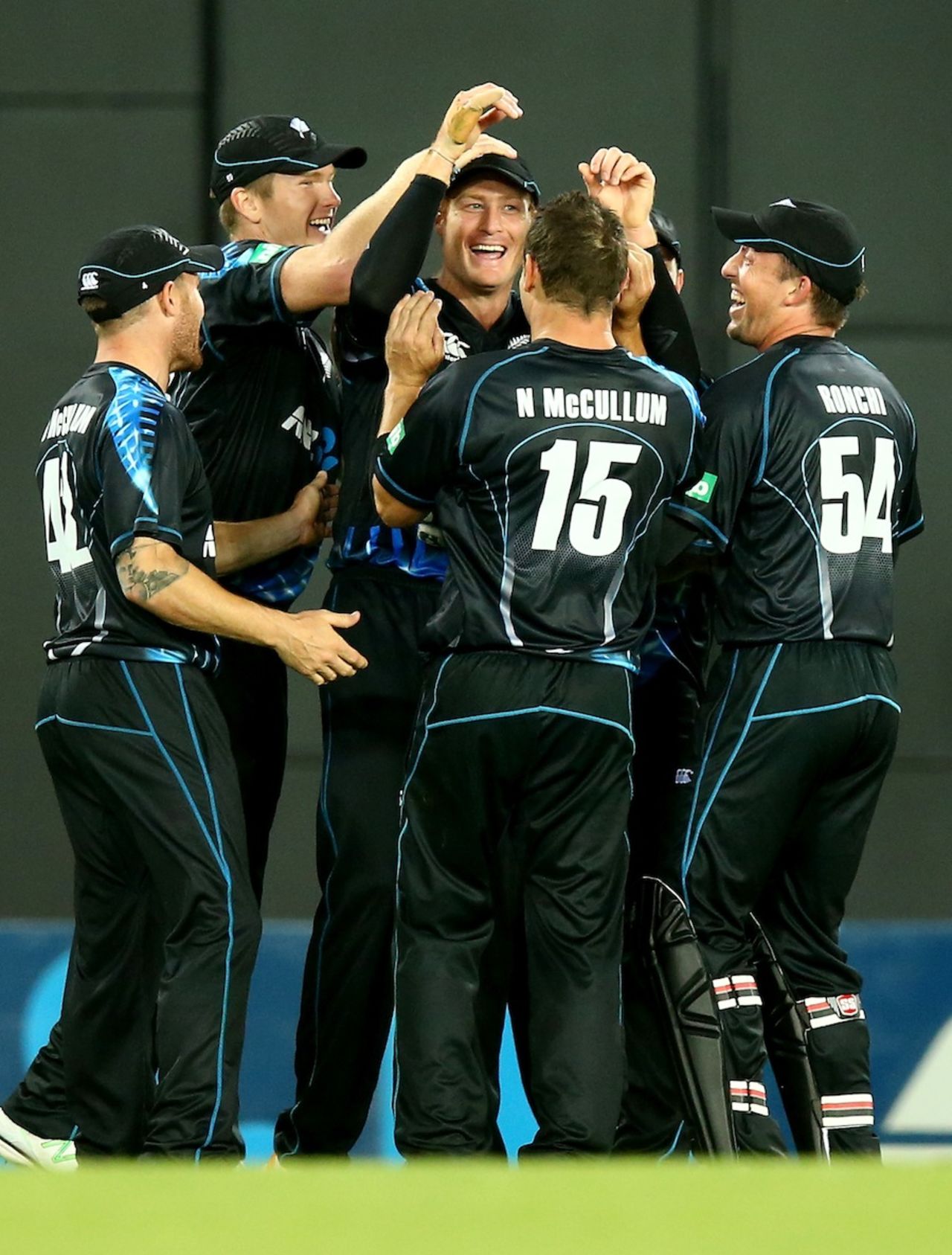 Martin Guptill is mobbed after taking a catch at the boundary, New Zealand v West Indies, 1st T20, Auckland, January 11, 2014