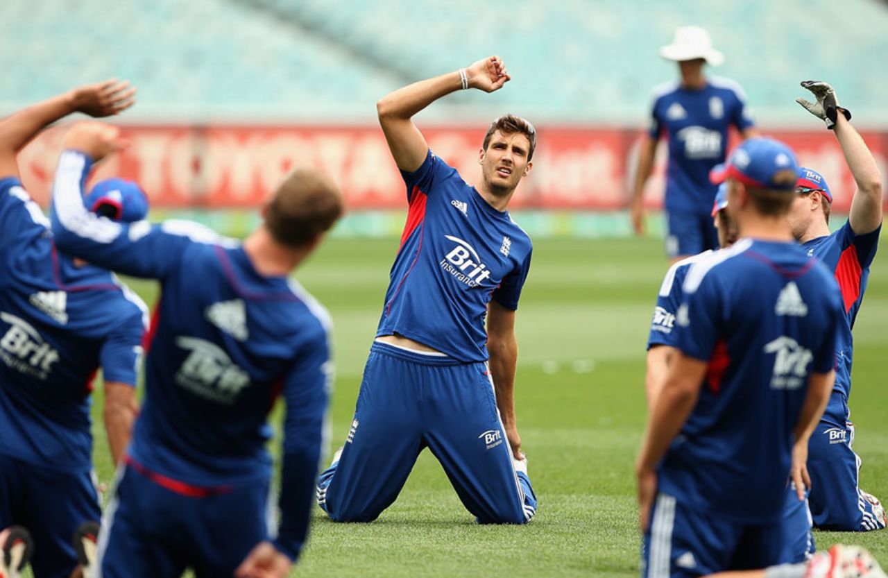 Hands up who wants to play some one-day cricket? Steven Finn takes part in a stretching exercise, Melbourne, January 11, 2014