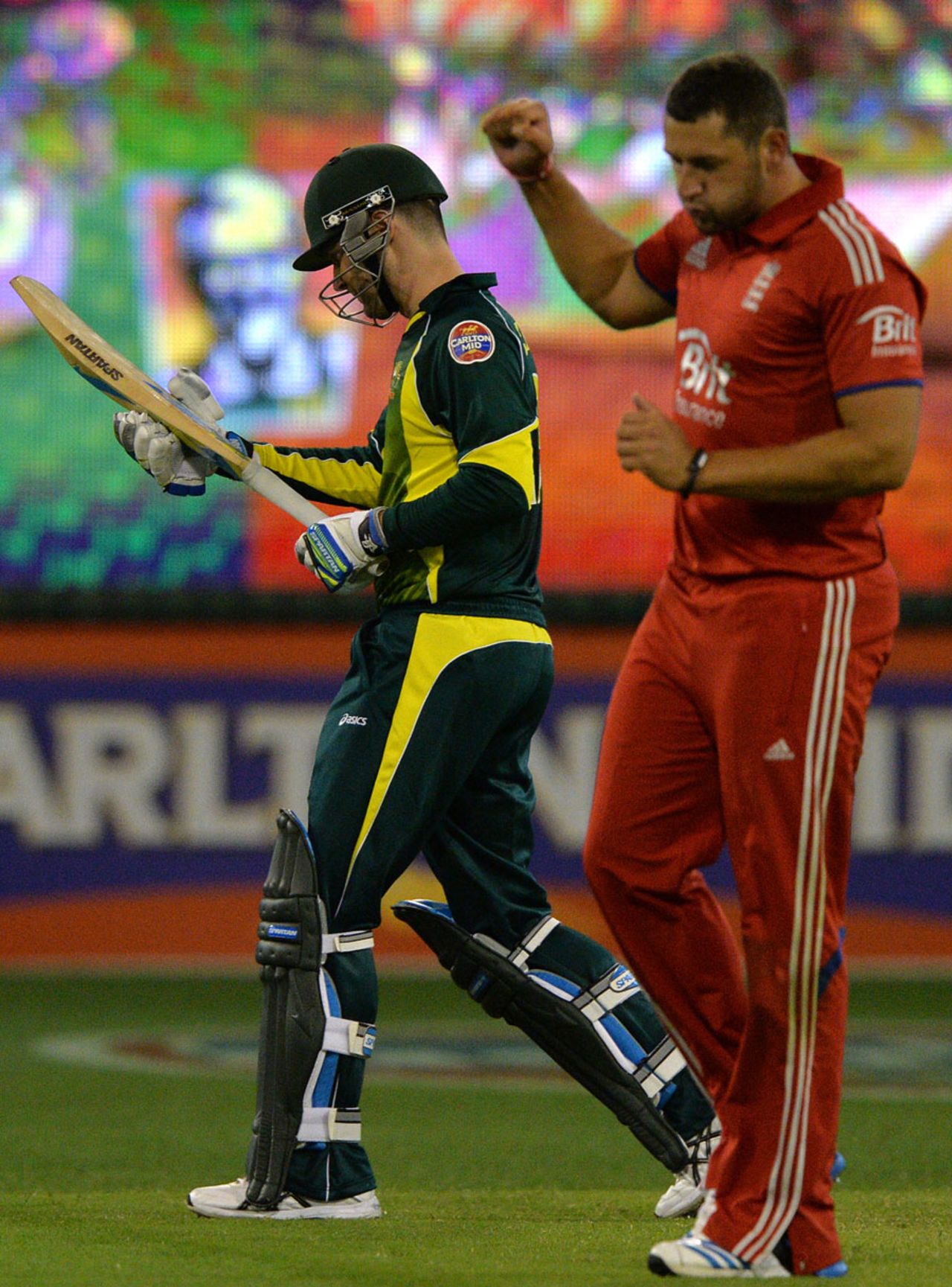 Michael Clarke looks at his bat after falling to Tim Bresnan, Australia v England, 1st ODI, Melbourne, January 12, 2014