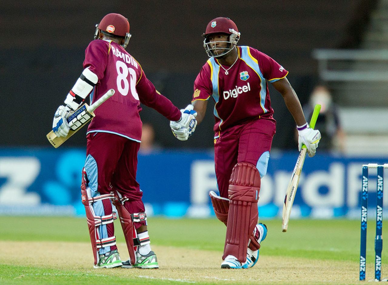 Andre Russell congratulates Denesh Ramdin for reaching his half-century, New Zealand v West Indies, 2nd T20, Wellington, January 15, 2014