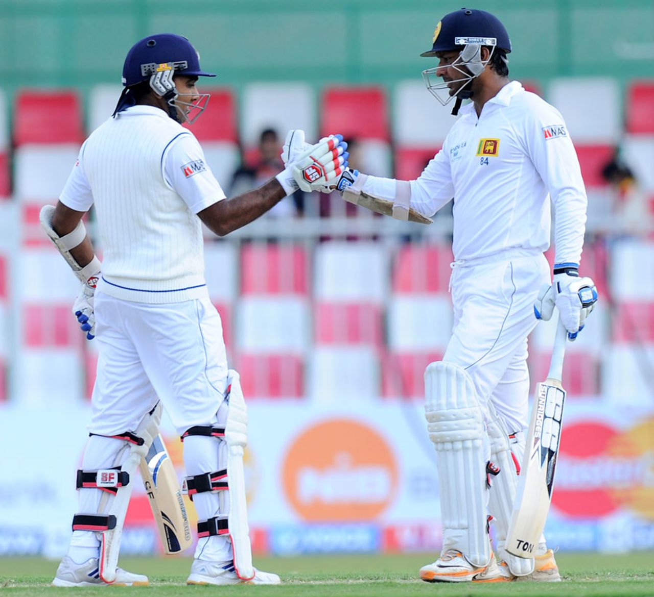Kumar Sangakkara and Mahela Jayawardene punch gloves, Pakistan v Sri Lanka, 3rd Test, Sharjah, 1st day, January 16, 2014