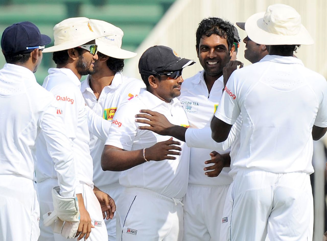 Dilruwan Perera celebrates after dismissing Azhar Ali for his first Test wicket, Pakistan v Sri Lanka, 3rd Test, Sharjah, 3rd day, January 18, 2014