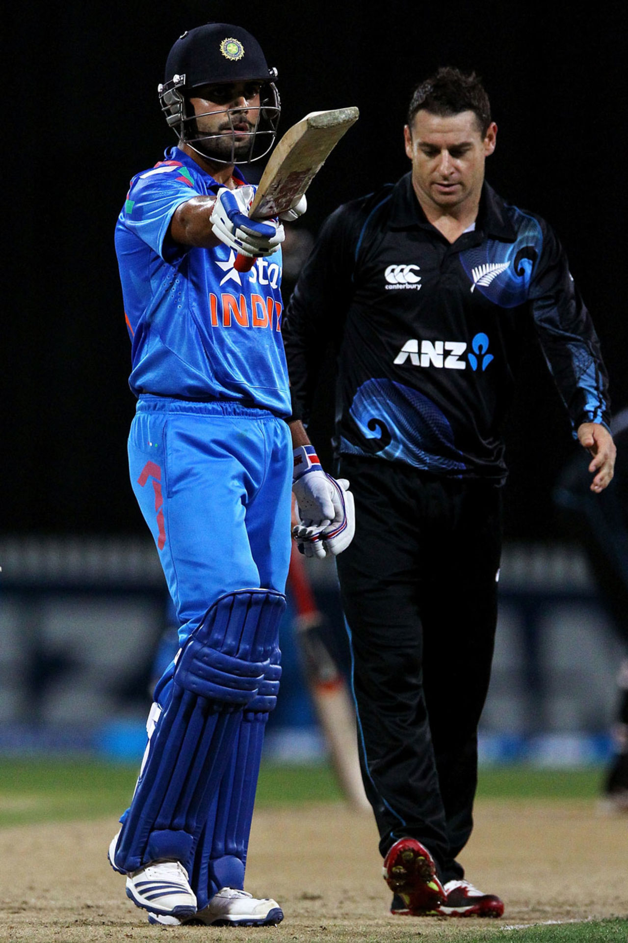 Virat Kohli raises his bat after scoring 50, New Zealand v India, 2nd ODI, Hamilton, January 22, 2014