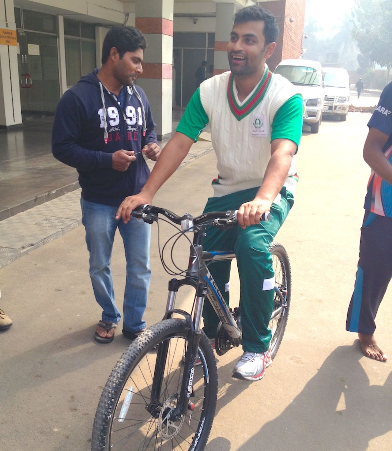Tamim Iqbal takes a bike ride outside the Sher-e-Bangla stadium, Dhaka, January 22, 2014