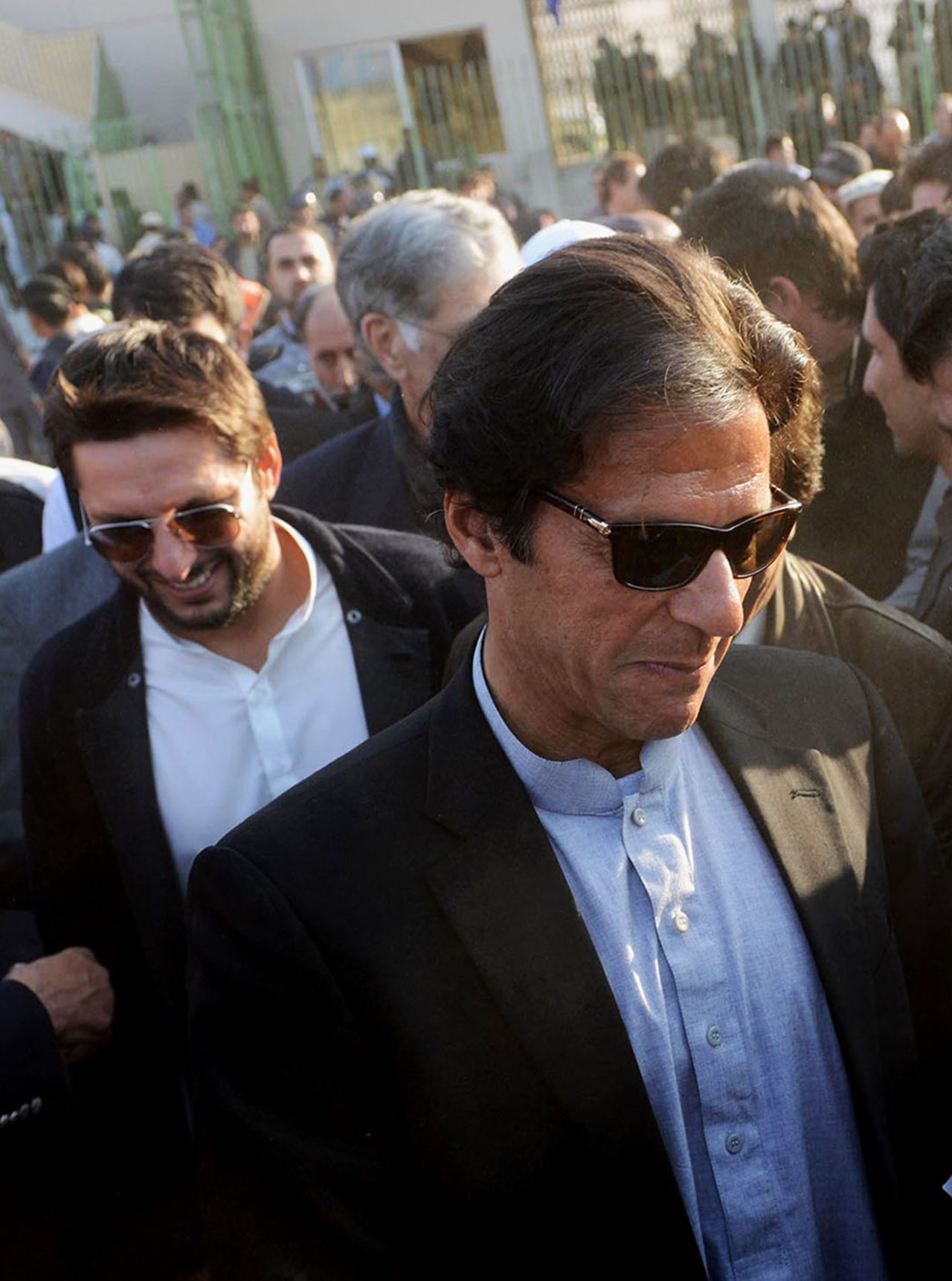 Imran Khan and Shahid Afridi arrive at the launch of a cricket talent hunt, Peshawar, January 25, 2014