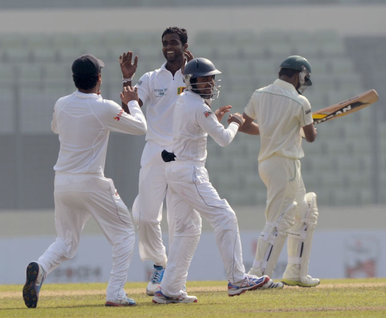 Shaminda Eranga is congratulated after taking a wicket, Bangladesh v Sri Lanka, 1st Test, Mirpur, 1st day, January 27, 2014