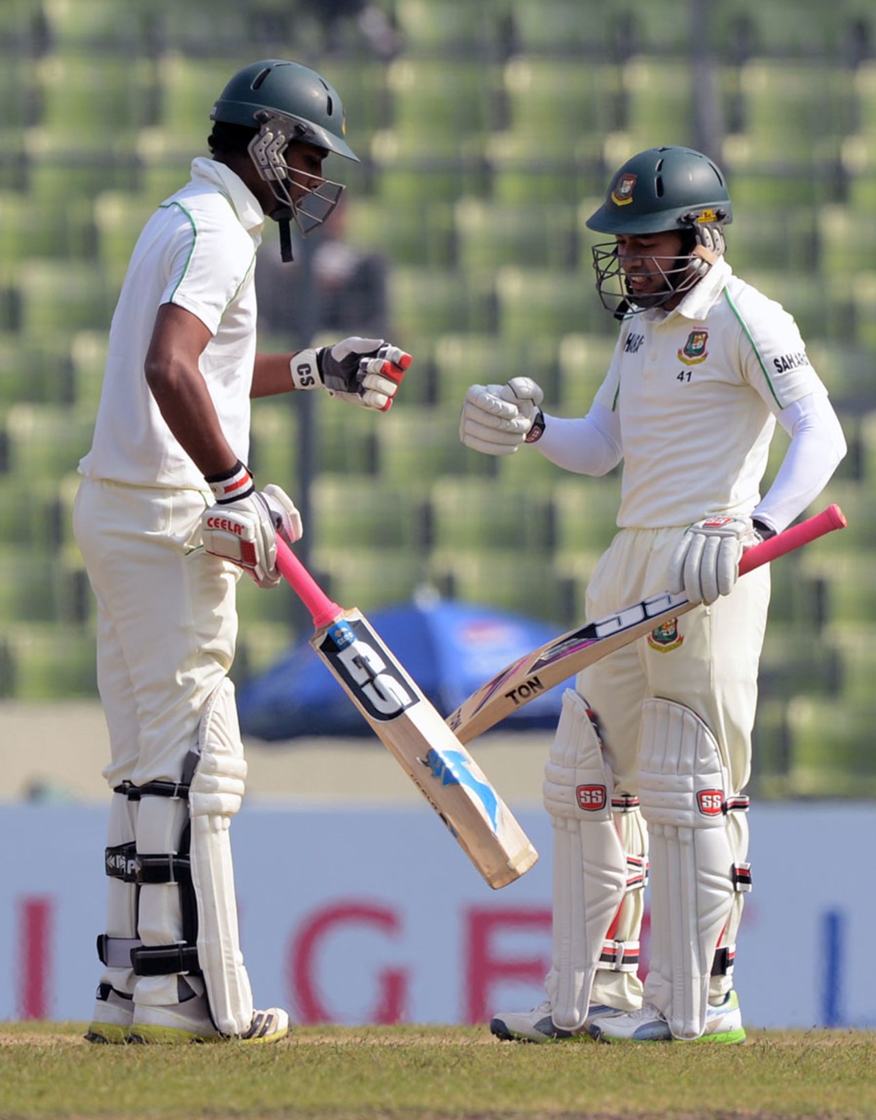 Mushfiqur Rahim and Sohag Gazi punch gloves, Bangladesh v Sri Lanka, 1st Test, Mirpur, 1st day, January 27, 2014