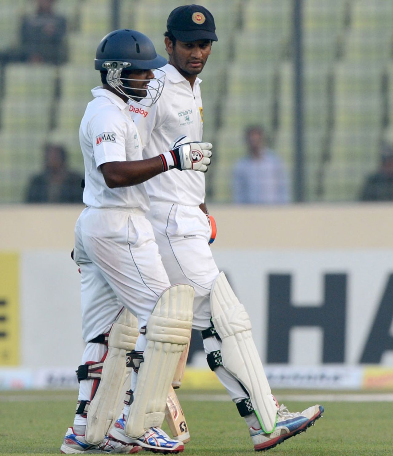 Kaushal Silva and Dimuth Karunaratne head back after a job well done, Bangladesh v Sri Lanka, 1st Test, Mirpur, 1st day, January 27, 2014
