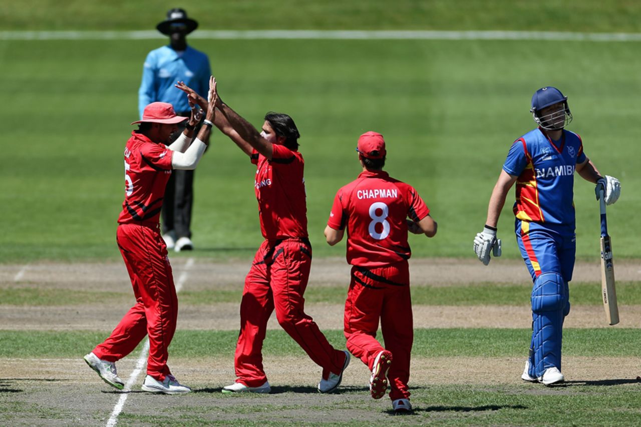 Haseeb Ahmed (2L) of Hong Kong celebrates with team mates after the wicket of Louis Klazinga of Namibia during the ICC Cricket World Cup Qualifier match between Namibia and Hong Kong at Mainpower Oval on January 28, 2014 in Rangiora, New Zealand. (Photo by Martin Hunter-IDI/IDI via Getty Images)