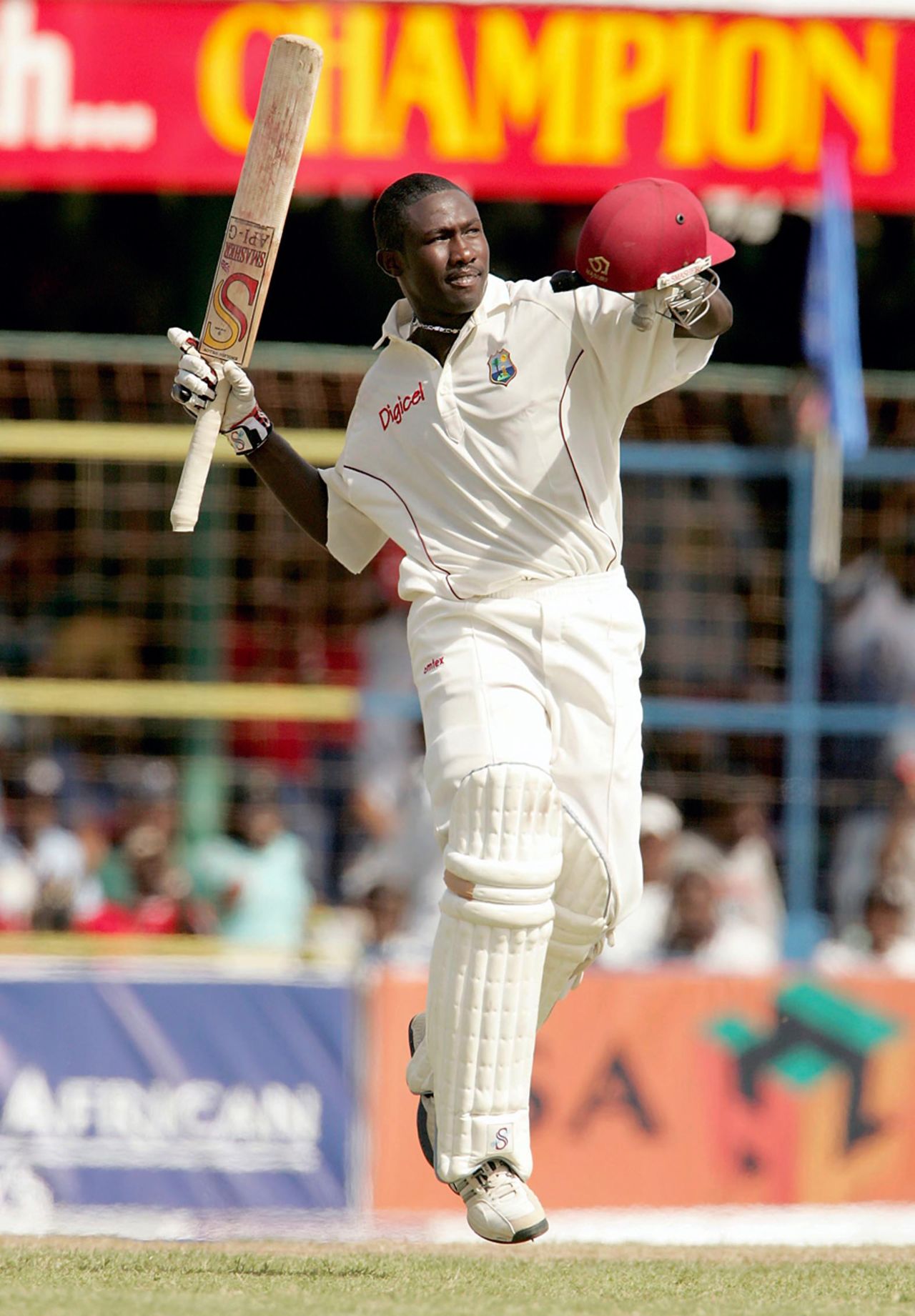 Wavell Hinds celebrates his hundred as South Africa toil against West Indies at Bourda, March 31, 2005