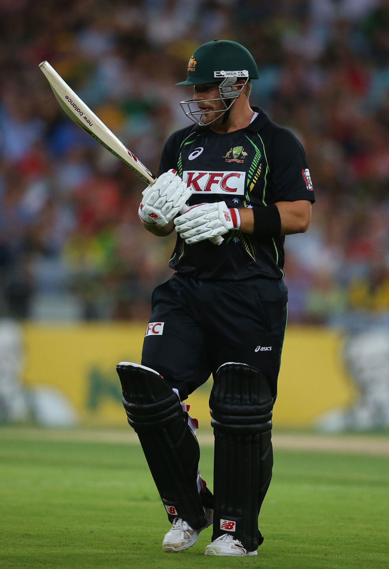 Aaron Finch examines his bat after falling to a miscue, Australia v England, 2nd T20, Sydney, February, 2, 2014