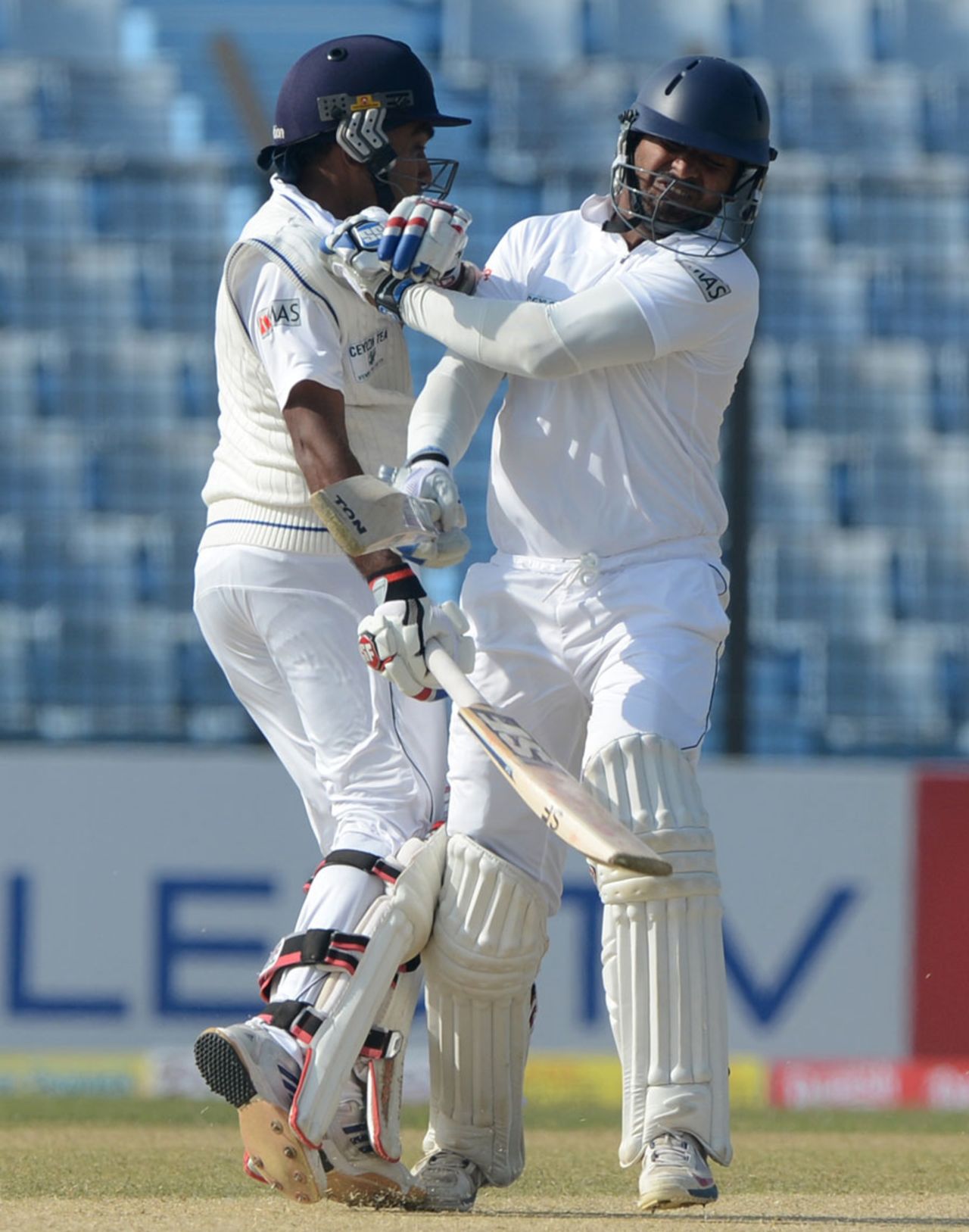 Mahela Jayawardene and Kumar Sangakkara collide while taking a run, Bangladesh v Sri Lanka, 2nd Test, Chittagong, 1st day, February 4, 2014
