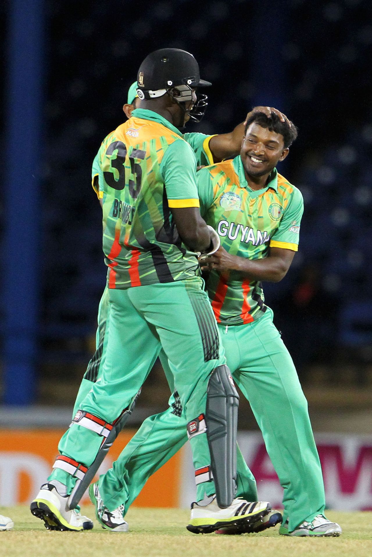 Veerasammy Permaul gets congratulated by teammates for spinning out the tail, Guyana v Windward Islands, Nagico Super50, Port-of-Spain, February 4, 2014