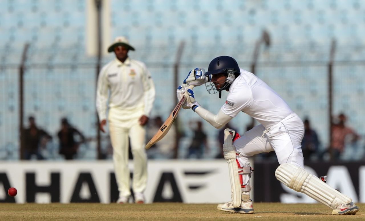 Kumar Sangakkara leans forward to execute a drive, Bangladesh v Sri Lanka, 2nd Test, Chittagong, 4th day, February 7, 2014