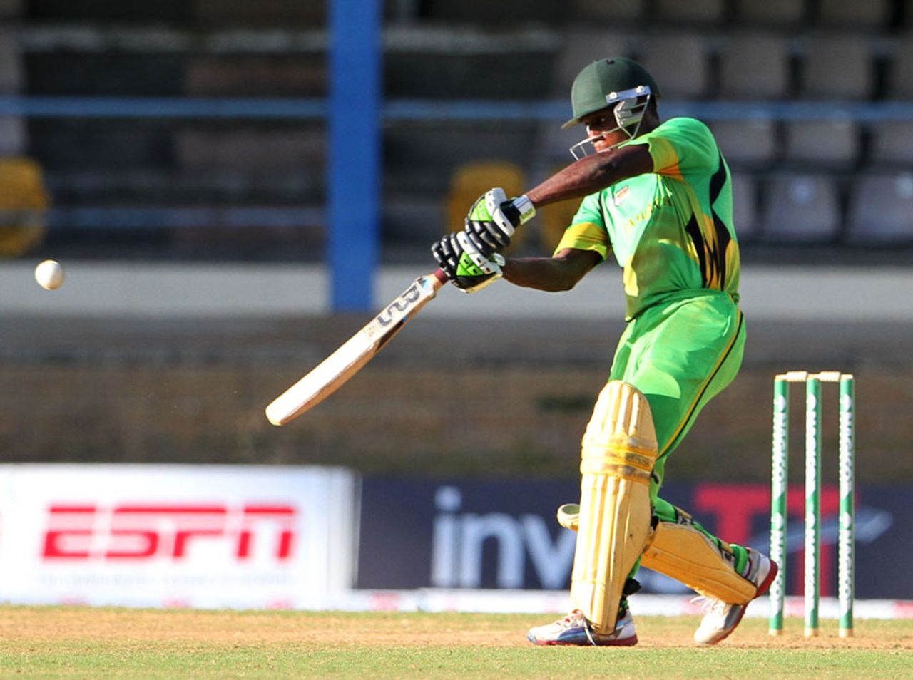 Nkrumah Bonner flays a six over the covers during his 122, Jamaica v Guyana, Nagico Super50, Zone A, Port of Spain, February 8, 2014