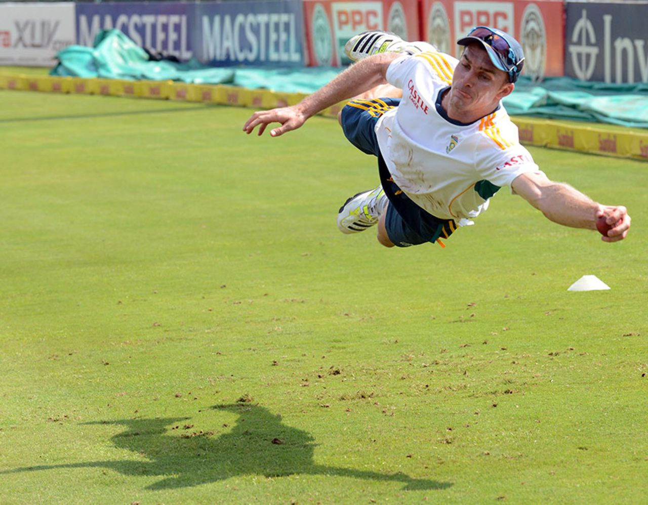 Ryan McLaren dives to take a catch during training, Centurion, February 10, 2014