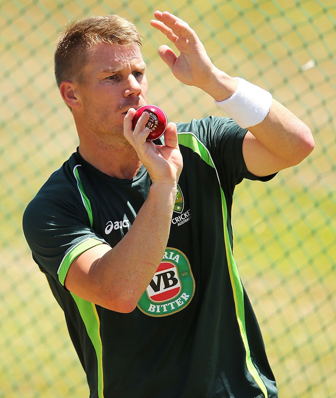 David Warner warms up with a bit of seam-up, Centurion, February 11, 2014