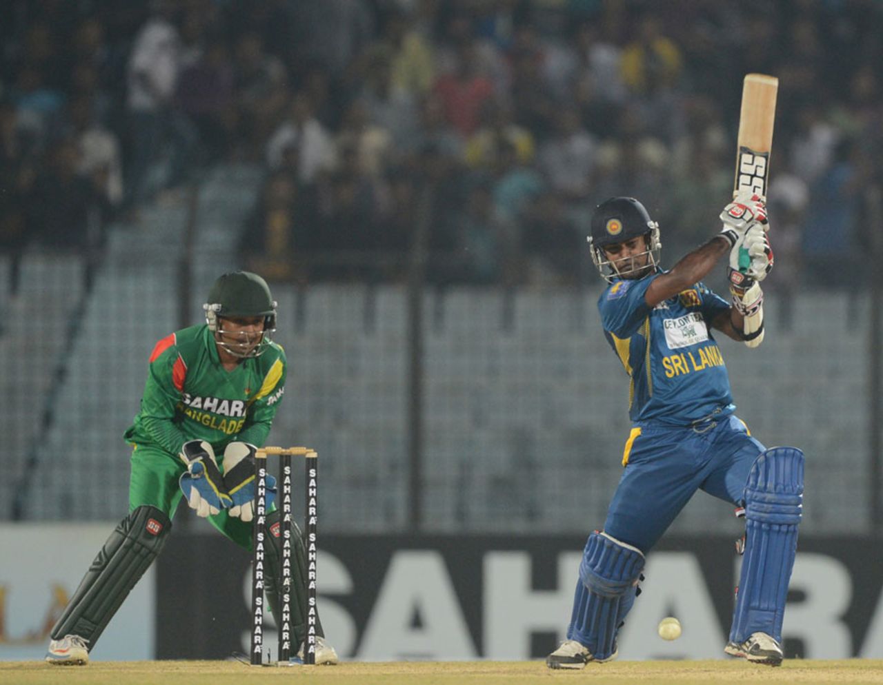 Nuwan Kulasekara flays the ball into the covers, Bangladesh v Sri Lanka, 1st T20, Chittagong, February 12, 2014