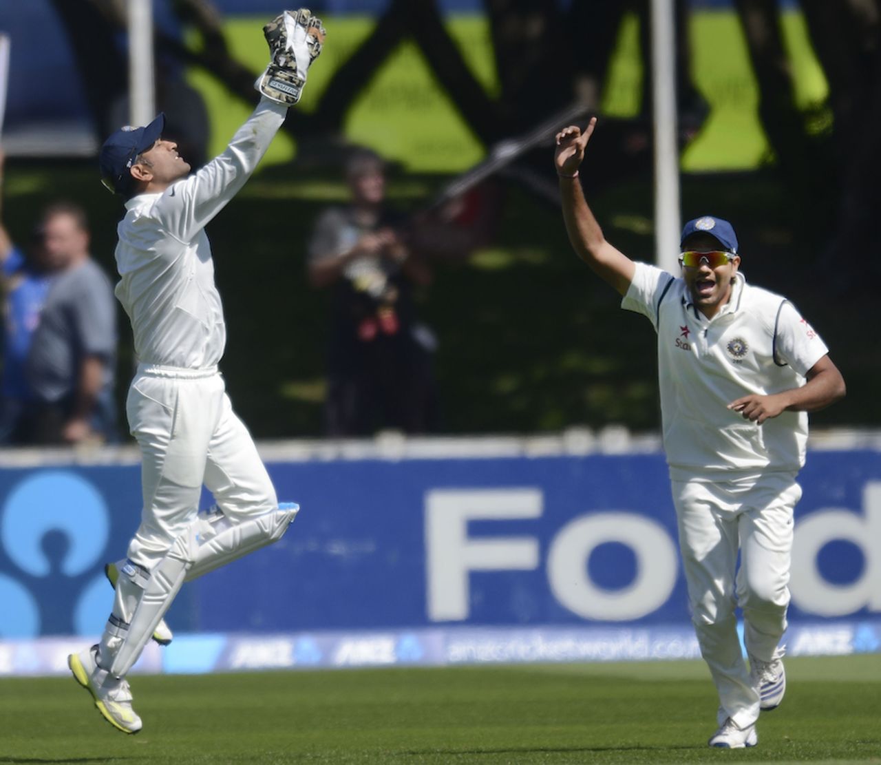 MS Dhoni and Rohit Sharma celebrate the wicket of Jimmy Neesham, New Zealand v India, 2nd Test, Wellington, February 14, 2014