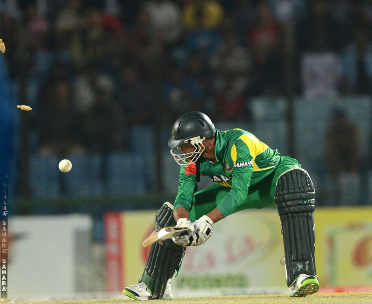 Mashrafe Mortaza looks back to see his stumps castled, Bangladesh v Sri Lanka, 2nd T20I, Chittagong, February 14, 2014