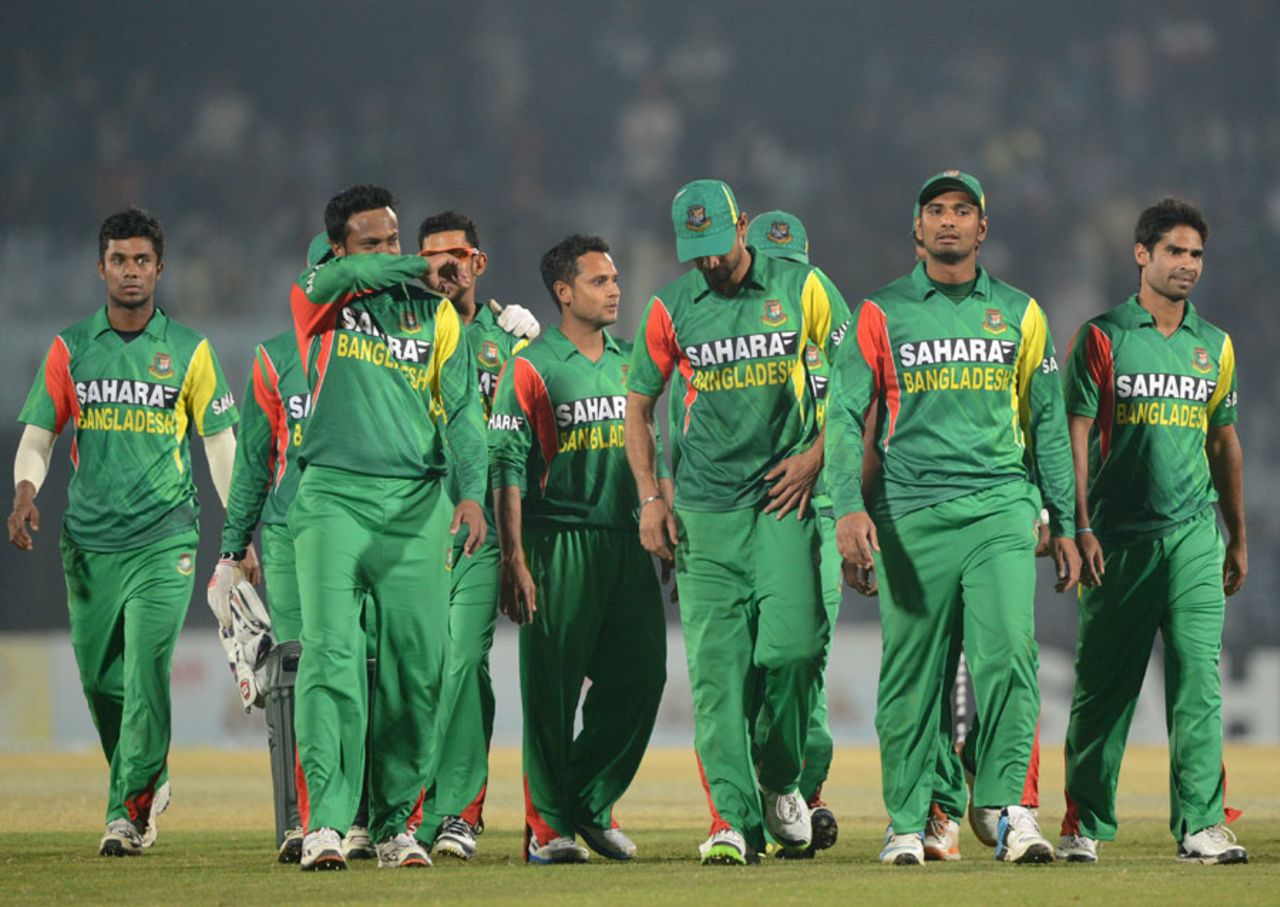 A disappointed Bangladesh team walk off after a second last-ball defeat in three days, Bangladesh v Sri Lanka, 2nd T20I, Chittagong, February 14, 2014