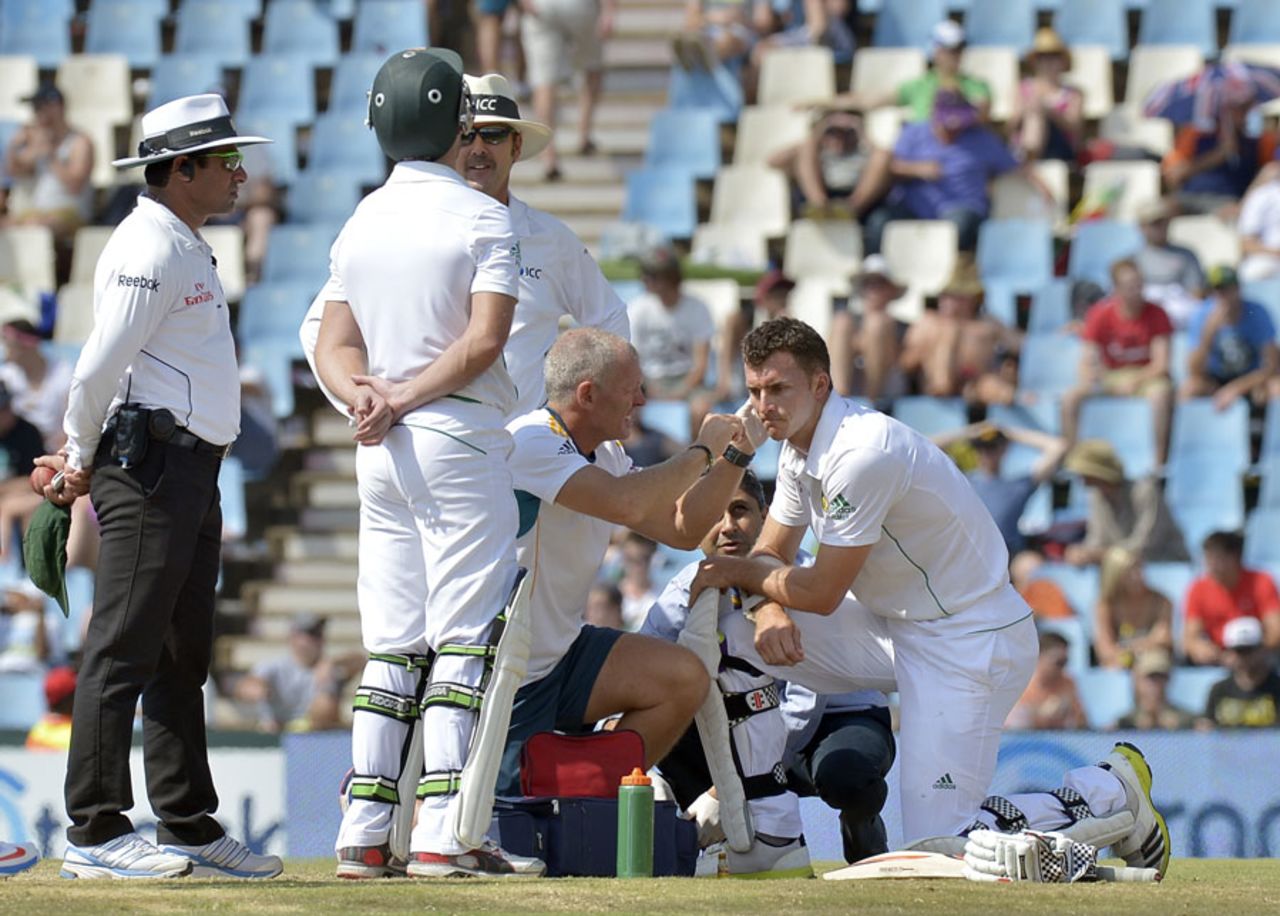 Ryan McLaren needed treatment after being hit on the head by Mitchell Johnson, South Africa v Australia, 1st Test, Centurion, 4th day, February 15, 2014