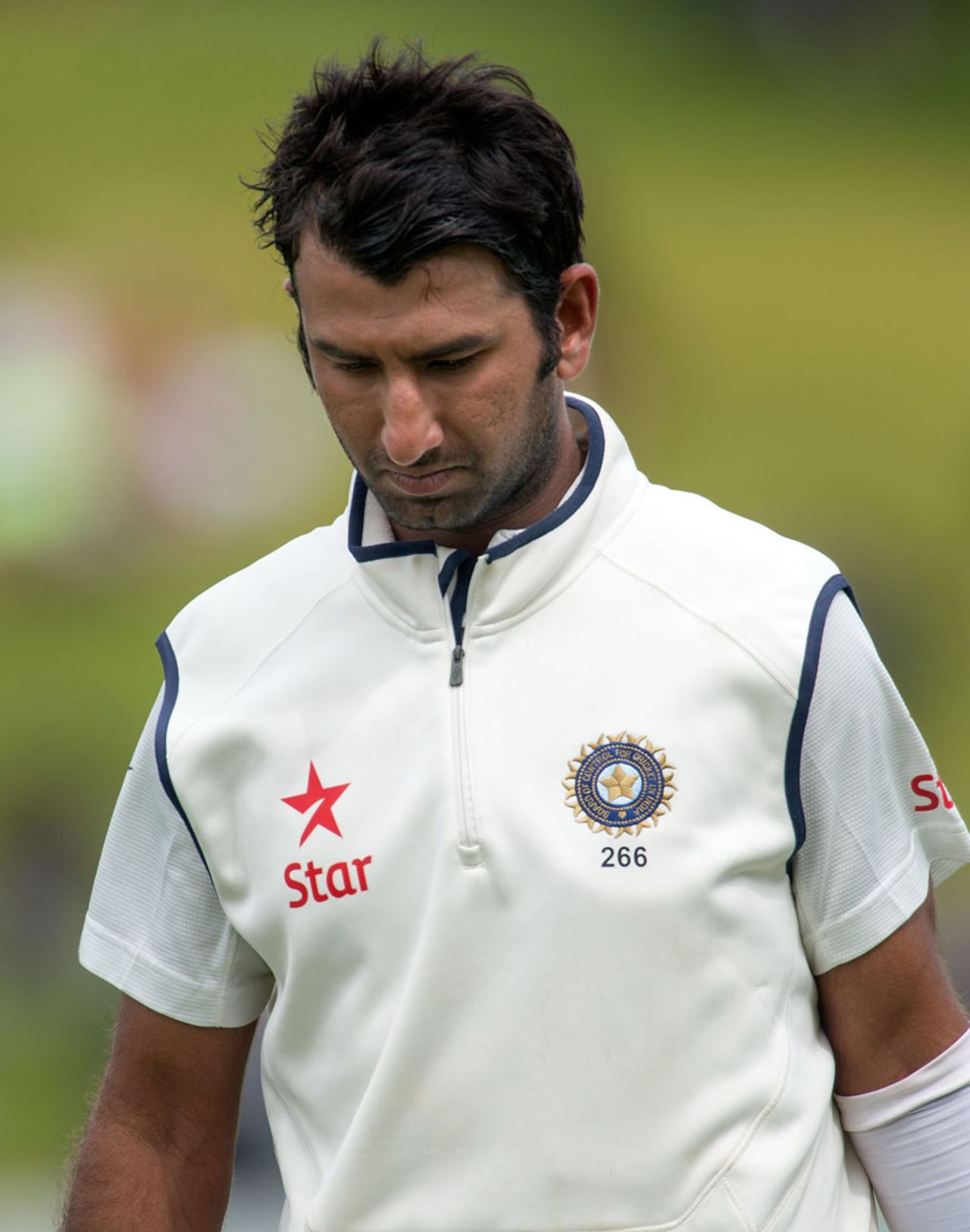 A dejected Cheteshwar Pujara walks back for 17, New Zealand v India, 2nd Test, Wellington, 5th day, February 18, 2014