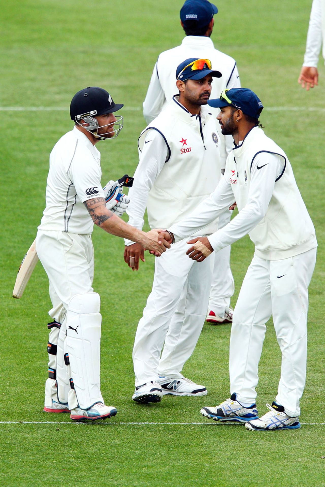 Brendon McCullum is congratulated by the Indian team after his 302, New Zealand v India, 2nd Test, Wellington, 5th day, February 18, 2014