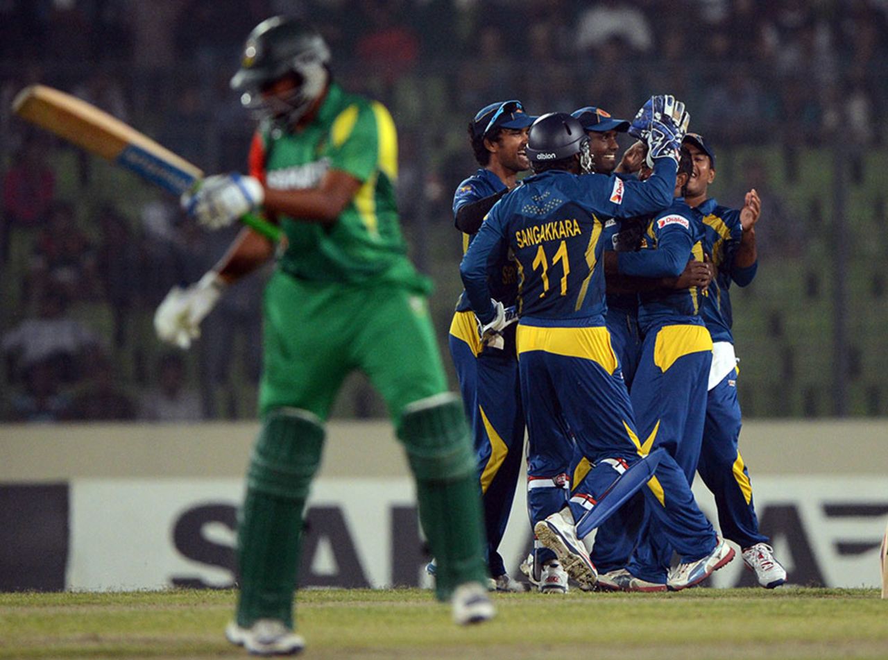 Shakib Al Hasan chides himself as Sri Lanka's players celebrate his dismissal, Bangladesh v Sri Lanka, 2nd ODI, Mirpur, February 20, 2014