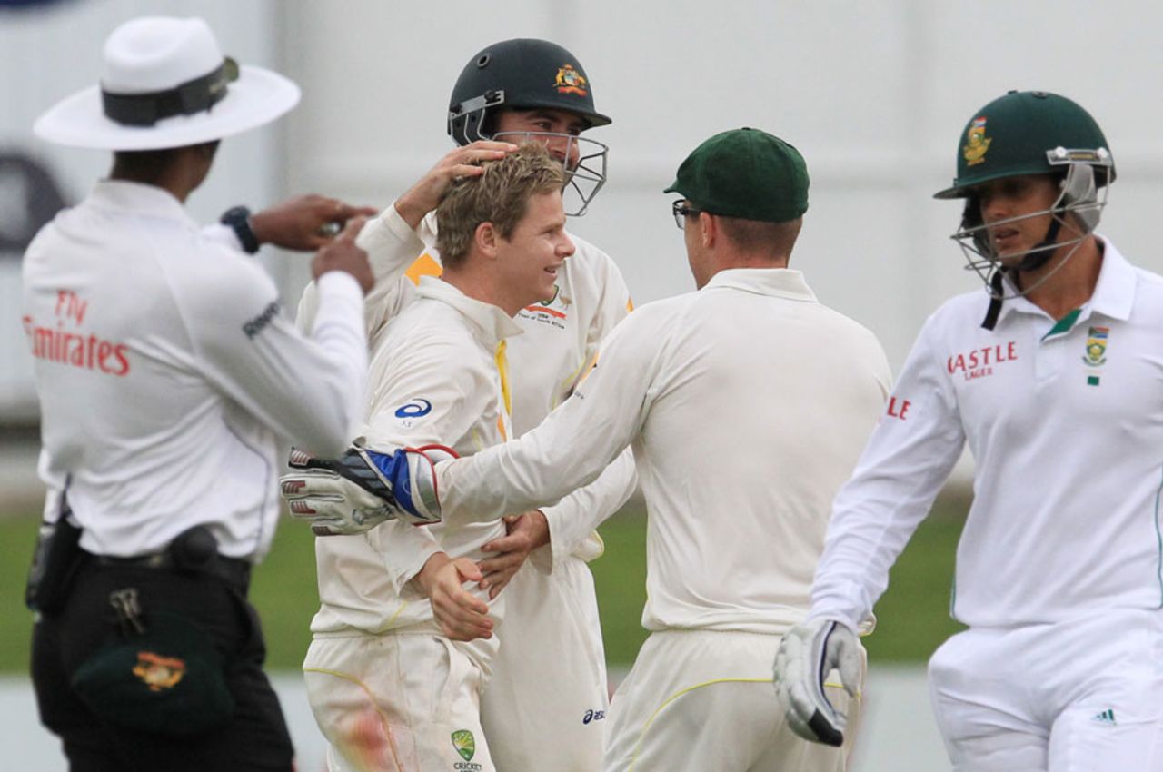 Team-mates congratulate Steven Smith after he dismissed Quinton de Kock, South Africa v Australia, 2nd Test, Port Elizabeth, 1st day, February 20, 2014