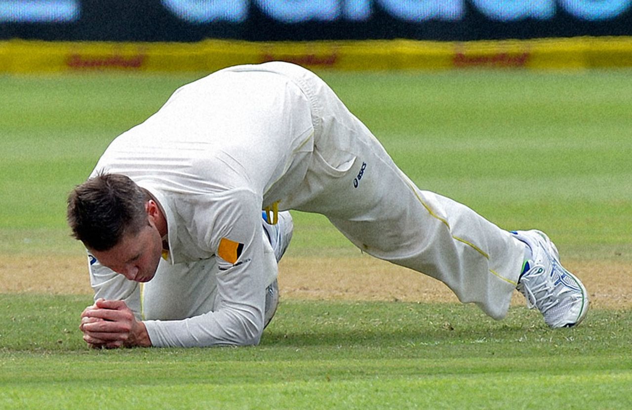 Michael Clarke dives to his left to catch Vernon Philander off his own bowling, South Africa v Australia, 2nd Test, Port Elizabeth, 2nd day, February 21, 2014