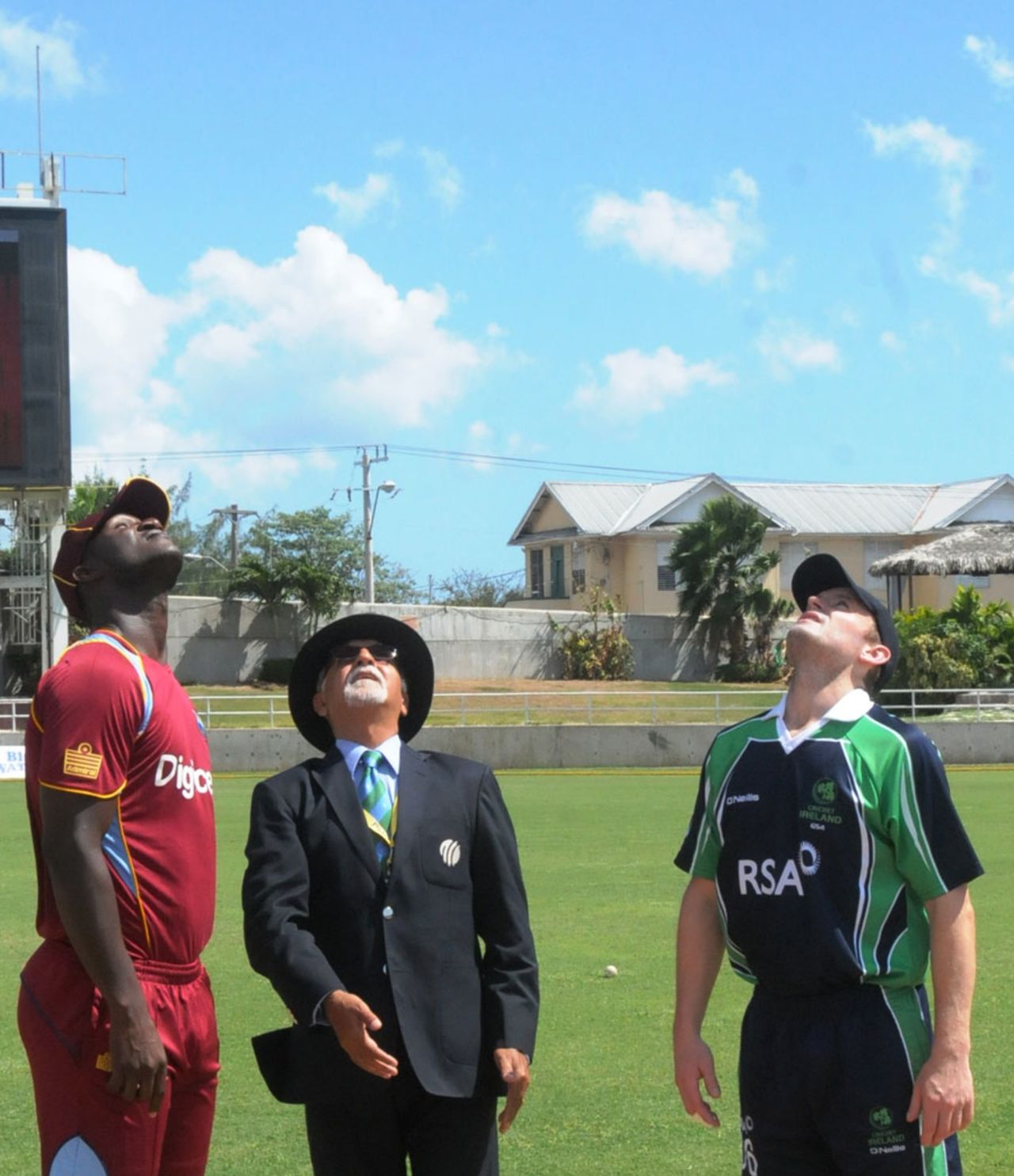 Darren Sammy and William Porterfield look up at the coin toss, West Indies v Ireland, 2nd T20, Kingston, February 21, 2014