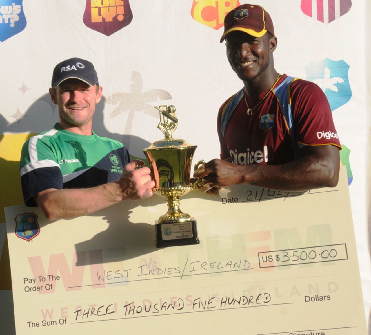 William Porterfield and Darren Sammy share the T20 trophy, West Indies v Ireland, 2nd T20, Kingston, February 21, 2014