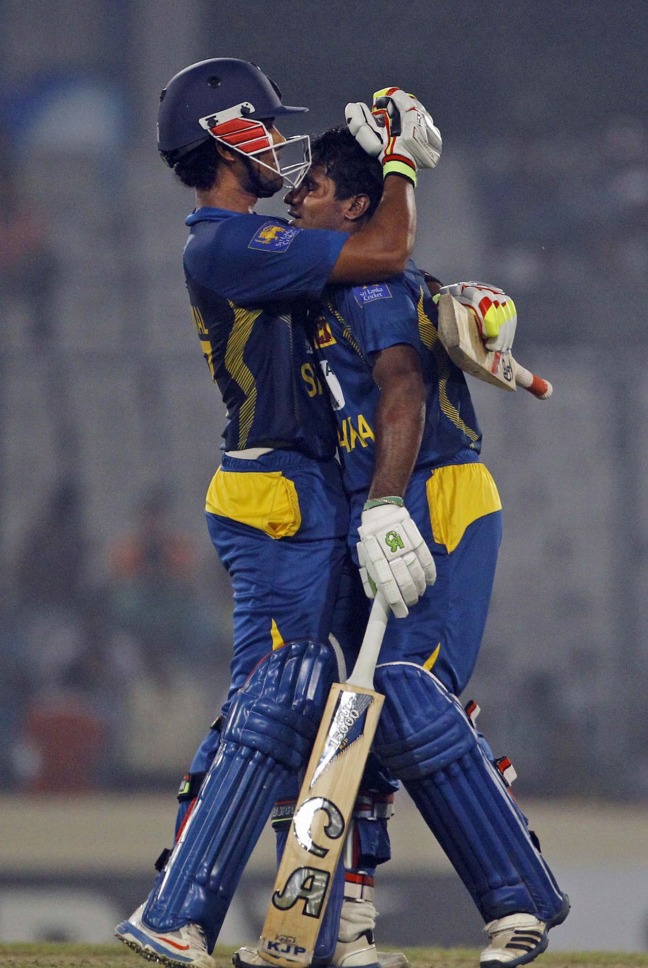 Dinesh Chandimal and Kusal Perera fall into an embrace, Bangladesh v Sri Lanka, 3rd ODI, Dhaka, February 22, 2014