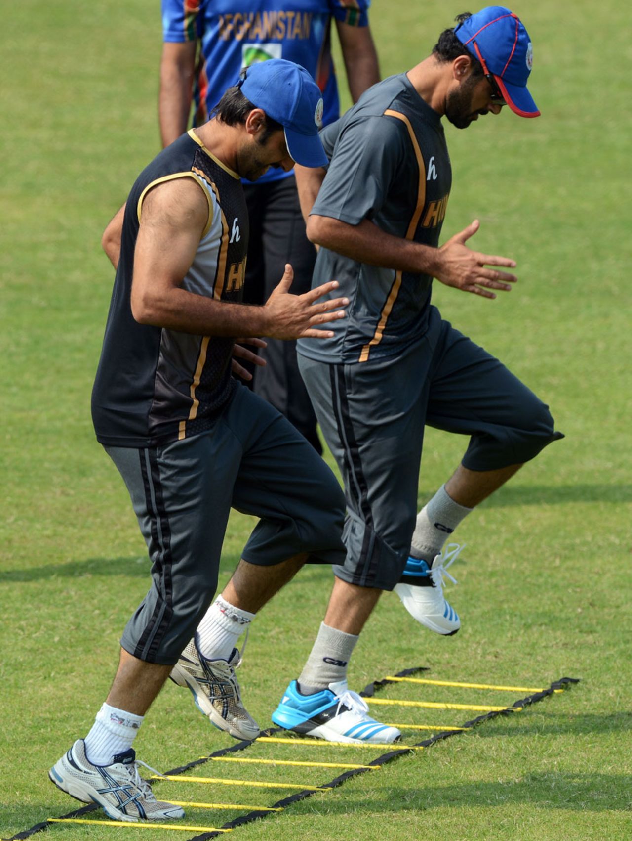 Asghar Stanikzai and a team-mate go through the paces during training, Mirpur, February 24, 2014