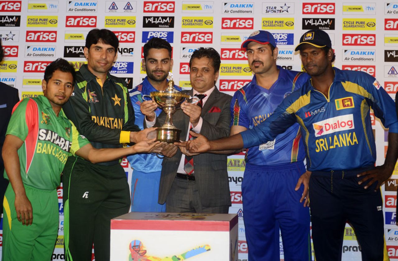 The captains of the participating teams pose with the Asia Cup Trophy, Dhaka, February 24, 2014
