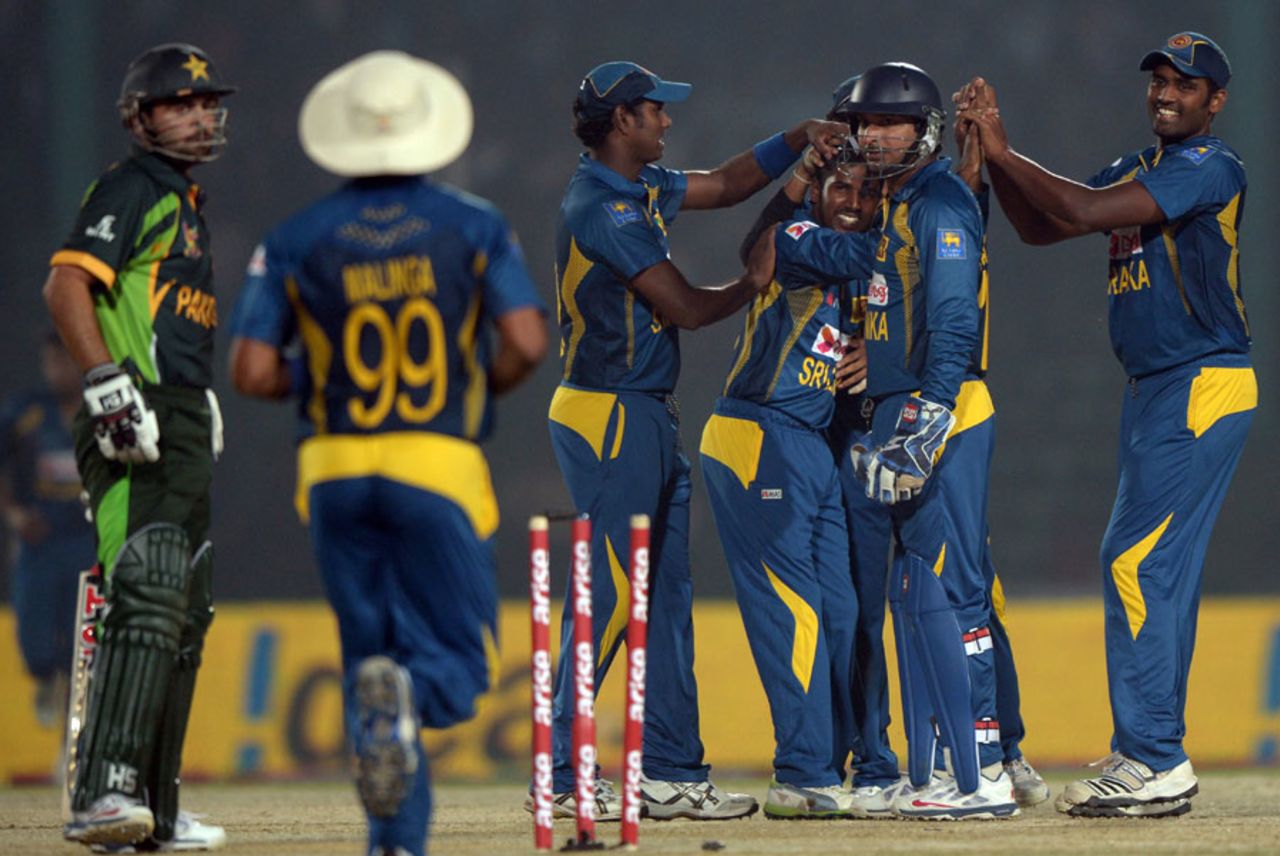 Team-mates congratulate Chaturanga de Silva for his maiden ODI wicket, Pakistan v Sri Lanka, Asia Cup, Fatullah, February 25, 2014