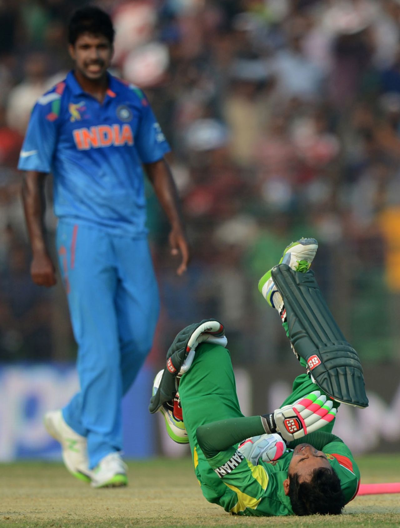 Mushfiqur Rahim lies in pain after being struck by a beamer, Bangladesh v India, Asia Cup 2014, Fatullah, February 26, 2014