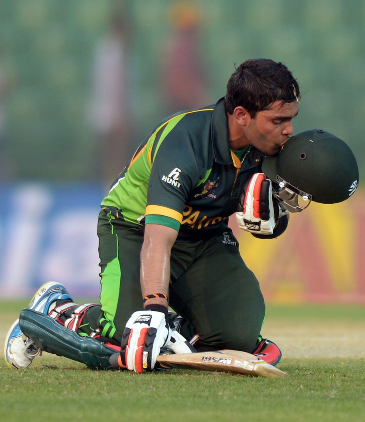 Umar Akmal kisses his helmet on reaching his fifty, Afghanistan v Pakistan, Asia Cup 2014, Fatullah, February 27, 2014