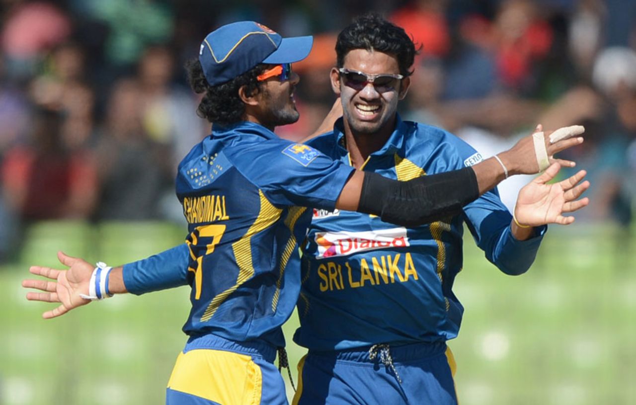 Sachithra Senanayake and Dinesh Chandimal celebrate a wicket, India v Sri Lanka, Asia Cup, Fatullah, February 28, 2014