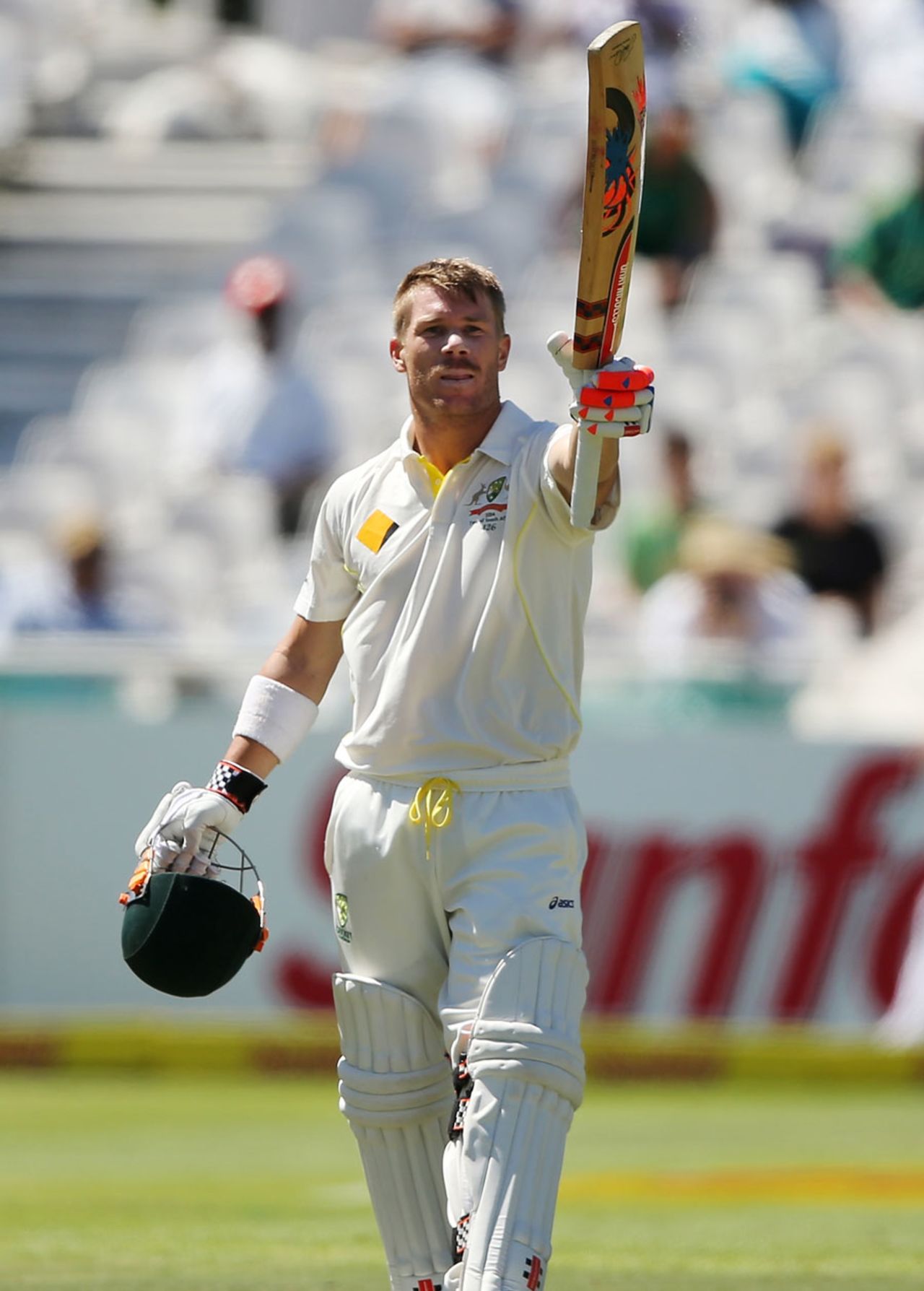 David Warner raises the bat after scoring a century, South Africa v Australia, 3rd Test, Cape Town, 1st day, March 1, 2014