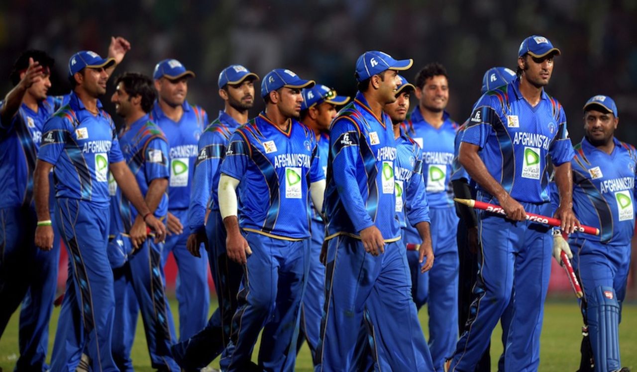 A victorious Afghanistan team walks back, Bangladesh v Afghanistan, Asia Cup, Fatullah, March 1, 2014