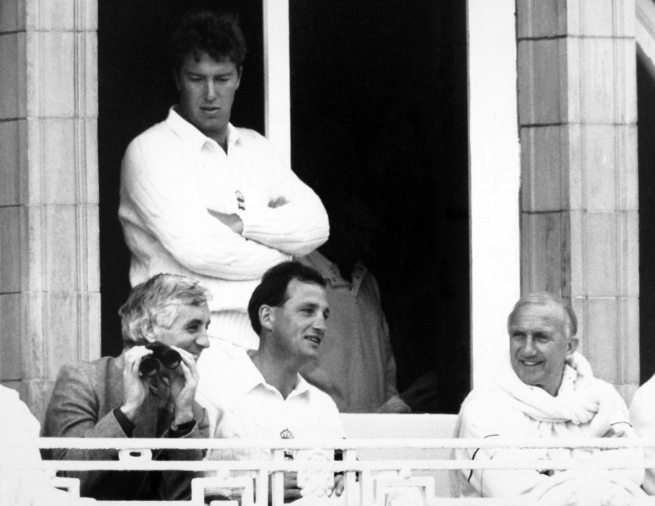Former England captain Mike Brearely sits with current captain John Emburey and manager Micky Stewart in the balcony, and bowler Derek Pringle stands at the back, England v West Indies, 2nd Test, Lord's, June 17, 1988