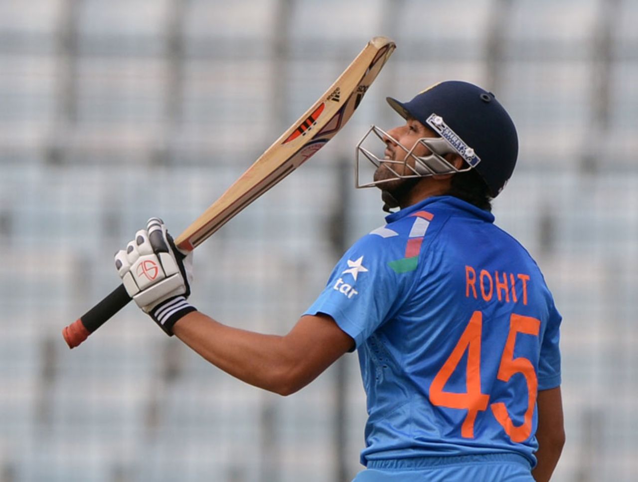 Rohit Sharma raises the bat after reaching his half-century, India v Pakistan, Asia Cup, Mirpur, March 2, 2014