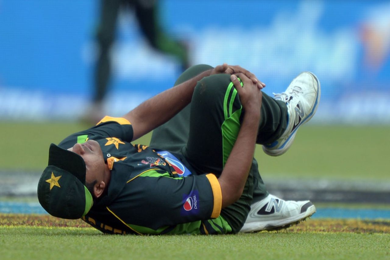 Sharjeel Khan lies down in pain after colliding with Mohammad Hafeez, India v Pakistan, Asia Cup, Mirpur, March 2, 2014