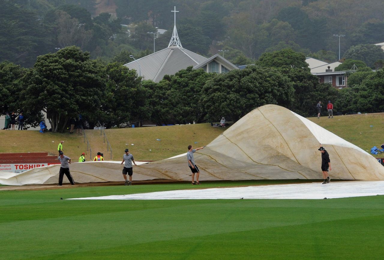 Ground staff struggle with the covers at the Basin Reserve, New Zealand v England, 2nd Test, Wellington, 5th day, March 18, 2013
