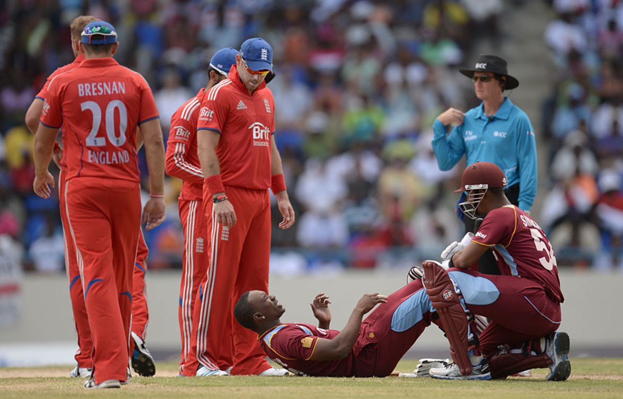 Dwayne Bravo needed treatment after his blow, West Indies v England, 2nd ODI, North Sound, March 2, 2014
