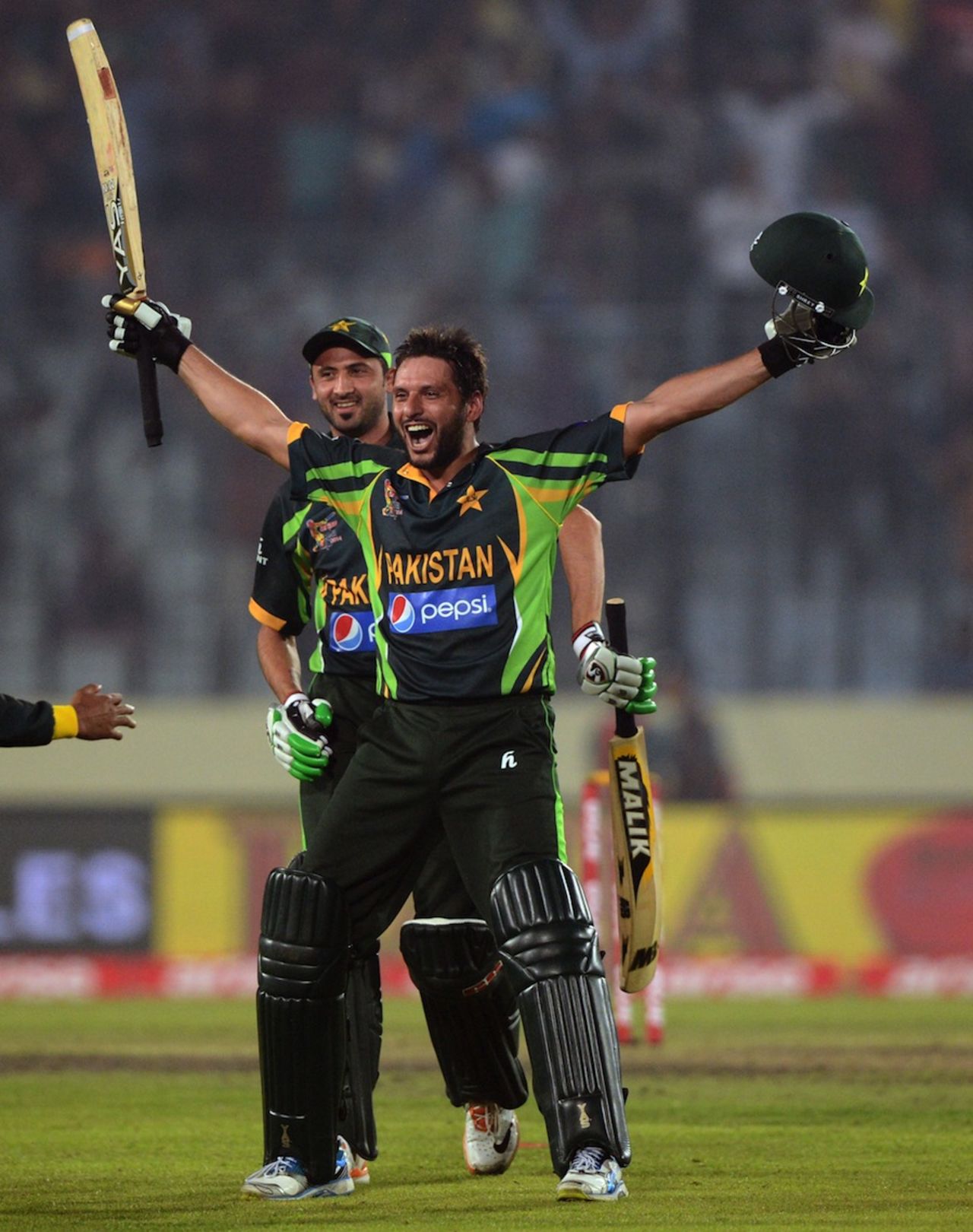 Shahid Afridi is joined by team-mates after winning the match, India v Pakistan, Asia Cup, Mirpur, March 2, 2014