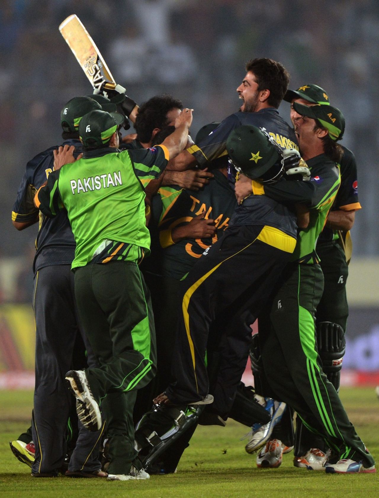 Shahid Afridi is mobbed by his team-mates, India v Pakistan, Asia Cup, Mirpur, March 2, 2014